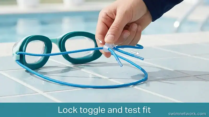 Cord lock toggle holding separated upper and lower bungee goggle bands.